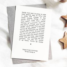 a card with an old fashioned poem on it next to some star shaped wooden objects