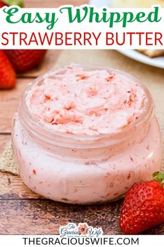 strawberry butter in a jar with strawberries on the side and text overlay that reads easy whipped strawberry butter