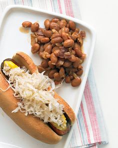 a hot dog with sauerkraut and beans on a plate