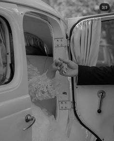 the bride and groom are getting out of their wedding car, ready to be married