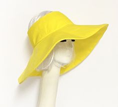 Topless oversized sun hat yellow cotton blend twill fabric has 2" soft top that fits comfortably, bendable one piece 5" brim and 1" soft black cotton band inside. One size fits most up to 23" Machine wash cold / hand dry Made in USA Packable / press if needed Sun Visor Hat, Yellow Sun, Visor Hat, Cold Hands, Visor Hats, Sun Visor, Soft Tops, Dry Hands, Twill Fabric