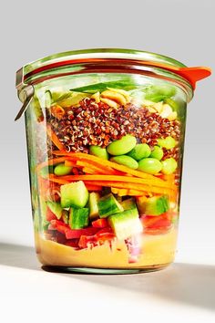 a glass jar filled with lots of different types of food in it's lid