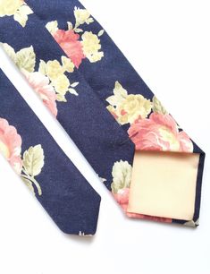 DESCRIPTION: This lovely men's skinny tie has been handmade using a beautiful vibrant pink floral print on navy blue linen. Please be aware that each tie purchased may vary, this is due to the large placement of the print. FABRIC: Linen. LINING FABRIC: Cotton. -------------------------------------------------------------------------------------------- DETAILS: * Made the traditional way with fabric cut on the bias * Each tie has canvas lining throughout * Fabric lining just at the tip on each en Pink Floral Tie, Mens Floral Tie, Wedding Tie, Navy Blue Linen, Tie Men's, Wedding Ties, Dog Bows, Special Delivery, Printed Ties