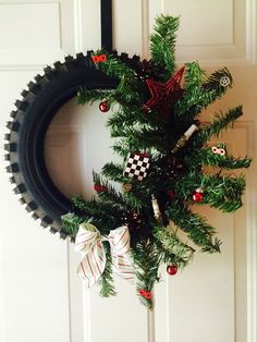 a christmas wreath hanging on the front door