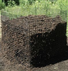 a large pile of dirt sitting in the middle of a field