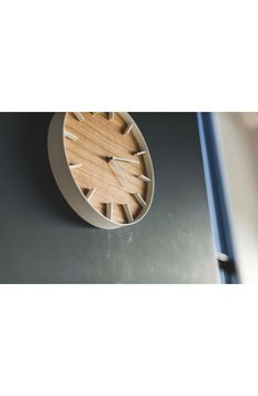 a wooden clock sitting on top of a table