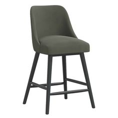 an upholstered bar stool with dark wood legs and a green fabric seat cover