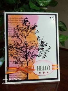 a card with a tree on it and the words hello written in orange, white, and pink