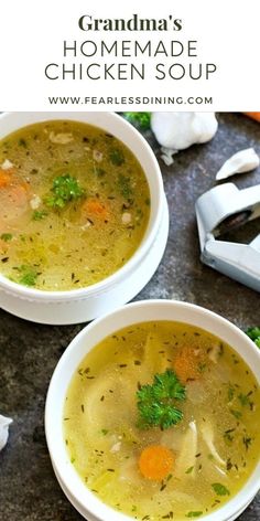 two bowls of chicken soup with carrots and parsley