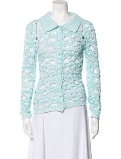 a mannequin wearing a blue jacket and white skirt