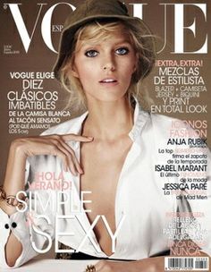 a woman is posing on the cover of a magazine