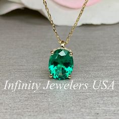 "The pendant pictured is lab created emerald #6259 Shown in 14k white gold and 14k yellow gold -Approximate total carat weight: approx. 2.10ctw diamond equivalent -Center Stone Size: 9x7mm - approx. 2.10ct diamond equivalent -Center Stone Shape: oval -Gem Type: lab created emerald -Stone Clarity: VS2 -Stone Color: green -Moh's Scale: 8.5 hardness -Metal Type and Purity: 14k yellow gold -Setting: 4 prong basket head -Chain: delicate 14k gold chain / heavier option with lobster claw available (use Gold Necklace Emerald, Green Emerald Necklace, Emerald Pendant Necklace, Emerald Necklace Pendant, Necklace Emerald, Oval Necklace, Lab Created Emerald, Head Chain, Necklace Bridal