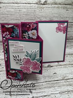 an open card with flowers on it