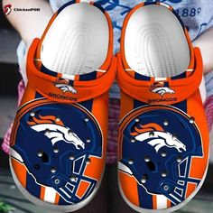 Introducing the Denver Broncos Unisex Classic Clogs, the ultimate footwear for die-hard fans! Show off your team pride in style with these comfortable and versatile clogs that are perfect for every occasion. Made from high-quality materials, these clogs are designed to provide durability and long-lasting use. Featuring the iconic Denver Broncos logo, these classic clogs are a must-have accessory for any true fan. Slip them on effortlessly and enjoy the lightweight feel that ensures all-day co... Crocband Crocs, Nfl Football Helmets, Denver Broncos Logo, Broncos Logo, Denver Broncos Football