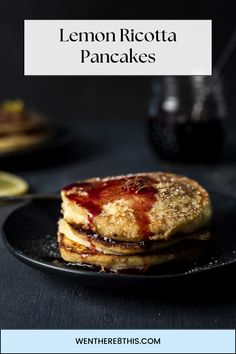 lemon ricotta pancakes on a black plate with text overlay that reads, lemon ricotta pancakes