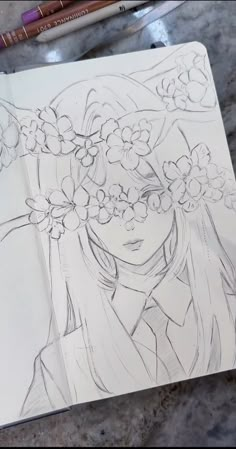 a drawing of a girl with flowers in her hair