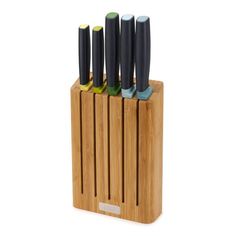 four knives in a bamboo holder on a white background