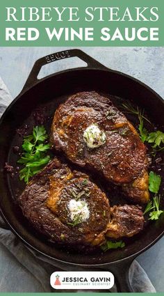 ribeye steaks with red wine sauce in a cast iron skillet