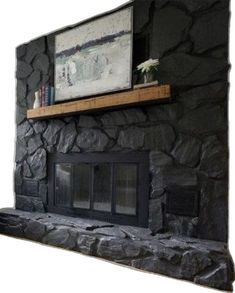 Painting Rock Wall Fireplace, Black Rock Wall Fireplace, Black Stone Corner Fireplace, Dark Wash Fireplace, Rock Chimney Makeover, Black Stone Fireplace Living Room, Grey Painted Rock Fireplace, Over Grouted Stone Fireplace Before And After, Black Stone Fireplace Modern