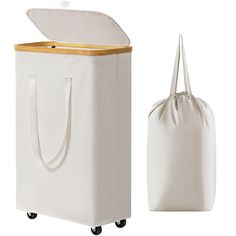 a large white bag next to a smaller white bag with a wooden handle on wheels