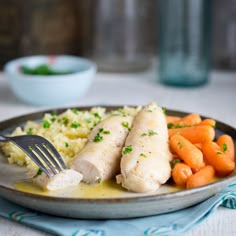 chicken, carrots and mashed potatoes on a plate with a fork in it