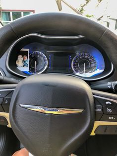 the interior of a car with two gauges