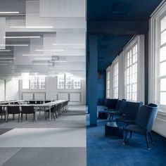 an empty conference room with blue carpet and white walls, along with tables and chairs