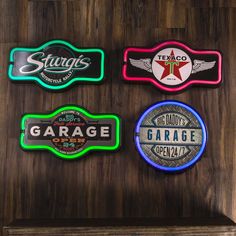 four neon signs are hanging on the wall next to a wooden shelf with a bottle opener