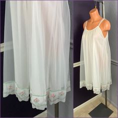 Beautiful vintage 60s semi sheer double layered nylon nightgown by Yolanda. Pretty semi sheer opaque shade of white with floral embroidered border near hem in pink and green. Tank style straps, trapeze shape body. Lined, closure free, pullover style. Flaw free. Labeled Yolanda and a medium. Please use measurements to determine fit- 37. 5” long, 38” bust, 42” waist, 50” hips White Sheer Nightgown For Spring, Vintage Sheer Nightgown For Summer, Sheer Spring Nightgown For Bedtime, Sheer Nightgown For Spring Bedtime, Sheer Nightgown For Wedding Night In Spring, Sheer Nightgown For Spring Wedding, Spring Wedding Sheer Nightgown, Embroidered Border, Soft Glam