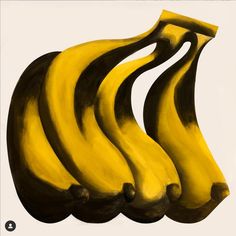 three yellow bananas sitting on top of each other