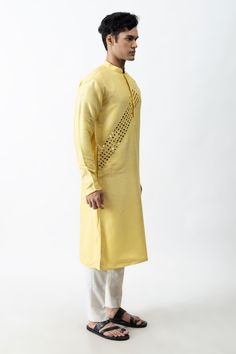 Yellow kurta with placement mirror embroidery and side slits. Comes with ivory straight pants.
Components:2
Pattern:Embroidery
Type of Work:Mirror
Neckline:Band Collar
Sleeve Length:Full
Fabric:Bam Silk and Cotton Silk
Color:Yellow,White
Other Details:
Side slits
Closure: Concealed button front
Occasion:Mehendi and Puja - Aza Fashions Mirror Placement, Yellow Mirror, Embroidery Mirror, Yellow Kurta, Mirror Embroidery, Kurta Pant Set, Pattern Embroidery, Kurta With Pants, Cotton Embroidery