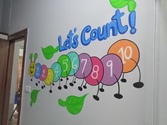 a very cute wall mural with the words let's count on it and caterpillars