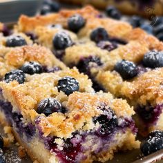 blueberry crumb bars with powdered sugar on top are ready to be eaten