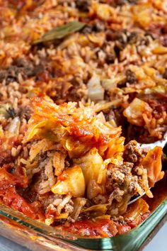 a casserole dish with meat, cheese and vegetables in it is ready to be eaten