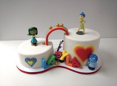 a birthday cake decorated with characters and letters