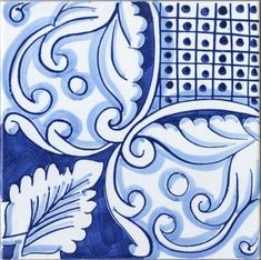 a blue and white tile with an abstract design