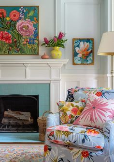 a living room filled with furniture and a fire place under a painting on the wall