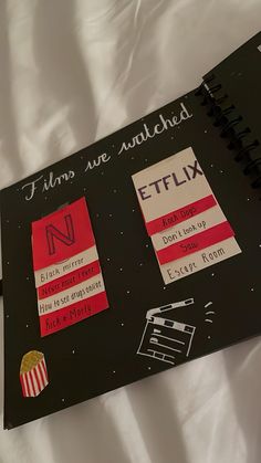 an open notebook with stickers and writing on it