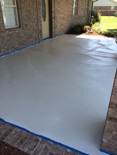 a house with a white tarp on the driveway