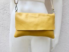 Leather bag in MUSTARD YELLOW . Natural, soft genuine leather. Small cross body bag in soft but strong leather. BOHO, Festival cross over bag.. Closed by a zipper and also a leather flap. The inside of the bag is fully lined in a strong nylon-cotton mix fabric eith a zipper closed pocket inside. Adjustable strap. Measurements: Width: 25 cm - 10 inch Height:18 cm - 7 inch This bag in different colors and other leather Bags by Good Times Barcelona: https://www.etsy.com/shop/goodtimesbarcelona?sect Yellow Leather Shoulder Flap Bag, Yellow Crossbody Flap Bag With Adjustable Strap, Yellow Leather Flap Bag For Everyday Use, Yellow Flap Bag With Adjustable Strap For Everyday Use, Yellow Soft Leather Crossbody Shoulder Bag, Cross Over Bag, Leather Obi Belt, Small Cross Body Bag, Small Leather Bag