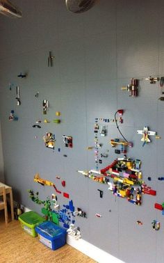 the wall is covered with legos and toys