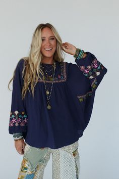 All of your boho dreams have come true with the Quinnlan Embroidered Tunic. You're going to love pairing this with all of your favorite bottoms! Lightweight Cotton gauze fabric Relaxed, loose and flowy silhouette with slight high-low bottom edge (perfect for your leggings!) Flattering round neckline and dropped shoulders and ruched center front panel Loose and long Dolman sleeves with elastic cinched cuffs So pretty floral embroidery details throughout for added boho style Pair with: Eye Of The Bohemian Embroidered Summer Top, Bohemian Embroidered Top For Summer, Bohemian Embroidered Top With Boho Collar For Spring, Spring Bohemian Embroidered Top, Bohemian Embroidered Relaxed Fit Blouse, Bohemian Summer Peasant Top With Embroidered Sleeves, Bohemian Embroidered Peasant Top For Spring, Bohemian Embroidered Peasant Top For Fall, Bohemian Rayon Top With Floral Embroidery