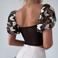 Elevate your wardrobe with our White Black Floral Embroidery Mesh Puff Sleeve Crop Top. This top features delicate mesh detailing, fluttery puff sleeves, and intricate butterfly and flower embroidery in stunning white and black tones. The square and sweetheart neckline combination adds a unique touch. Complete with lace-up detailing, this exclusive piece exudes sophistication and elegance. Perfect for those looking to enhance their style with a touch of femininity and charm. Delicate mesh detail Y2k Street Style, Purple Crop Top, Lace Trim Blouse, Mesh Corset, Backless Blouse, Puff Sleeve Crop Top, Vintage Crop Tops, Saint John, Embroidered Neckline