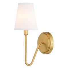 a wall light with a white shade on the side and a gold finish to it