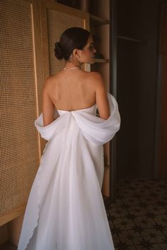 the back of a woman in a white dress