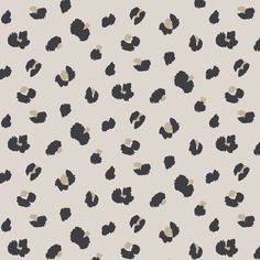 an animal print wallpaper with black and white spots on the back half of it