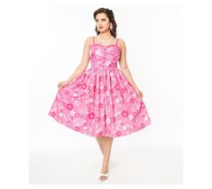 Step into a world of playful elegance with this swing dress that captures the essence of Barbie's timeless charm. This lightweight, woven dress features a delightful floral Barbie print, adjustable spaghetti straps, faux buttons, and side smocked panels for a comfortable, semi-fitted silhouette. A sweetheart neckline and knee-length cut add a touch of classic glamour, making it a versatile addition to your wardrobe. From Unique Vintage. Barbie Print, Classic Glamour, Pink Barbie, Fitted Silhouette, Woven Dress, Swing Dress, Vintage Pink, Sweetheart Neckline, Unique Vintage