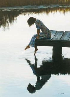 a person sitting on a bench in the water