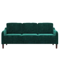 a green couch sitting on top of a white floor