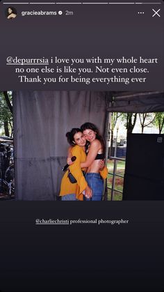 two women hugging each other in front of a screen with an instagram message on it